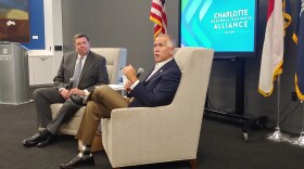 Thom Tillis (right) spoke with the Charlotte Business Alliance this summer.