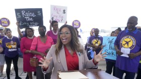 U.S. Rep. Sheila Cherfilus McCormick, D-Fla., who is running for reelection, gestures as she talks after members of the union that represents airport workers and security officers, endorsed her, Thursday, July 7, 2022, at the Fort Lauderdale-Hollywood International Airport in Fort Lauderdale, Fla. The members of 32BJ SEIU endorsed McCormick and other Haitian American and Jamaican American candidates who support their calls for higher wages and benefits. (AP Photo/Wilfredo Lee)