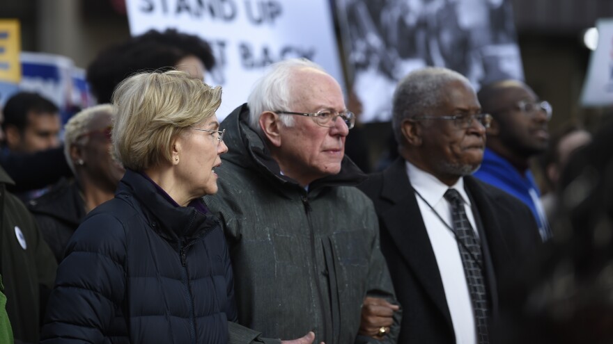 Democratic presidential candidates Elizabeth Warren and Bernie Sanders chat during a Martin Luther King Jr. Day march in January in Columbia, S.C.