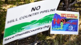 Signs opposing the Kinder Morgan pipeline in Driftwood, Texas. 