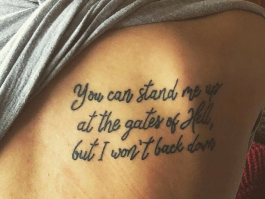 Ashley Ellis has lyrics from "I Won't Back Down" tattooed on her shoulder blade.