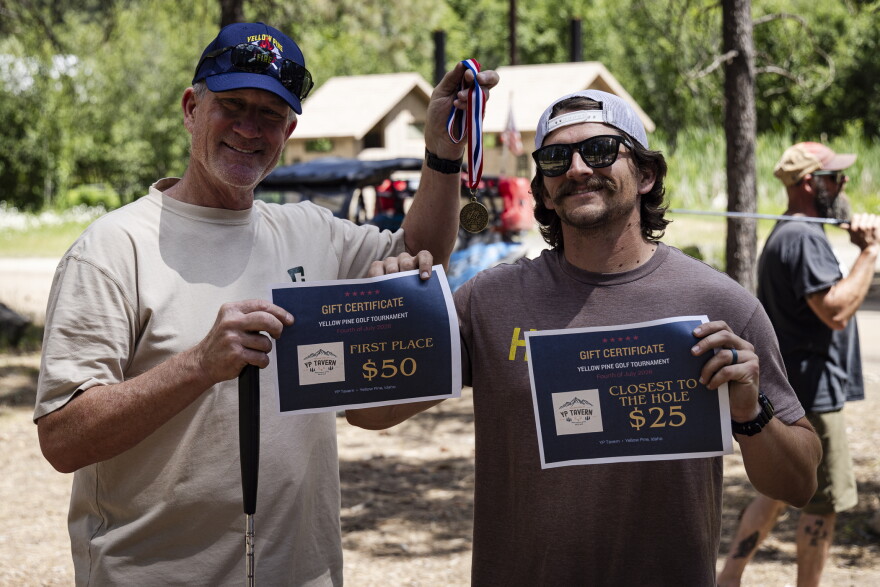 Tournament champions Rob Joyce, left, and Colton Ledford, who also won closest to the pin