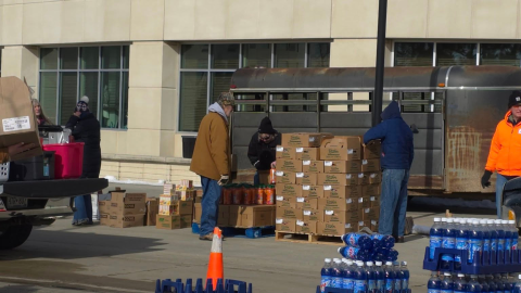 Volunteers work to distribute items during a Ruby's Pantry event at the Bemidji Sanford Center on March 19, 2026.