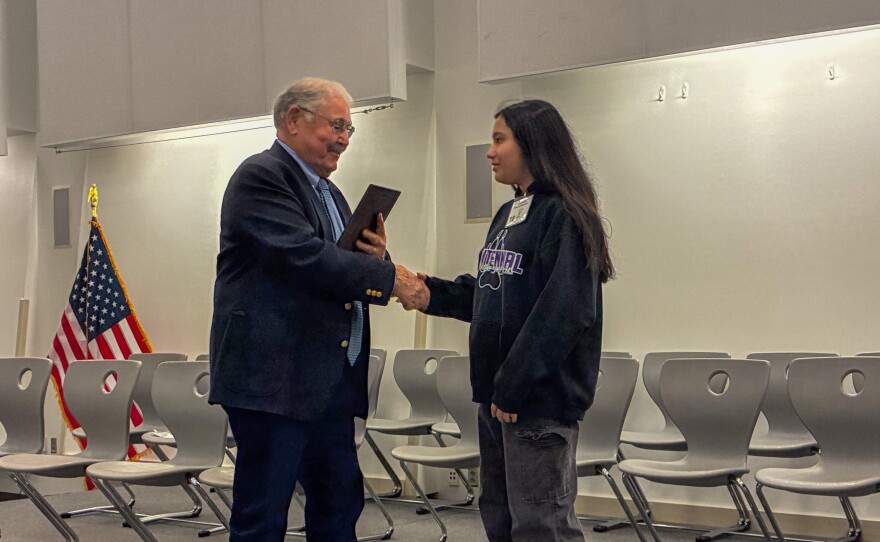 Yuma County School Superintendent Tom Hurt was proud to present Smriti Parajuli with her winner's plaque.