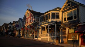 File - Early-morning light shines on shops on Main Street, Saturday, June 11, 2022, in Bar Harbor, Maine. Small businesses face a mix of old and new challenges as 2023 begins. A looming recession, still high (although easing) inflation and labor woes are a few things small businesses will have to tackle.