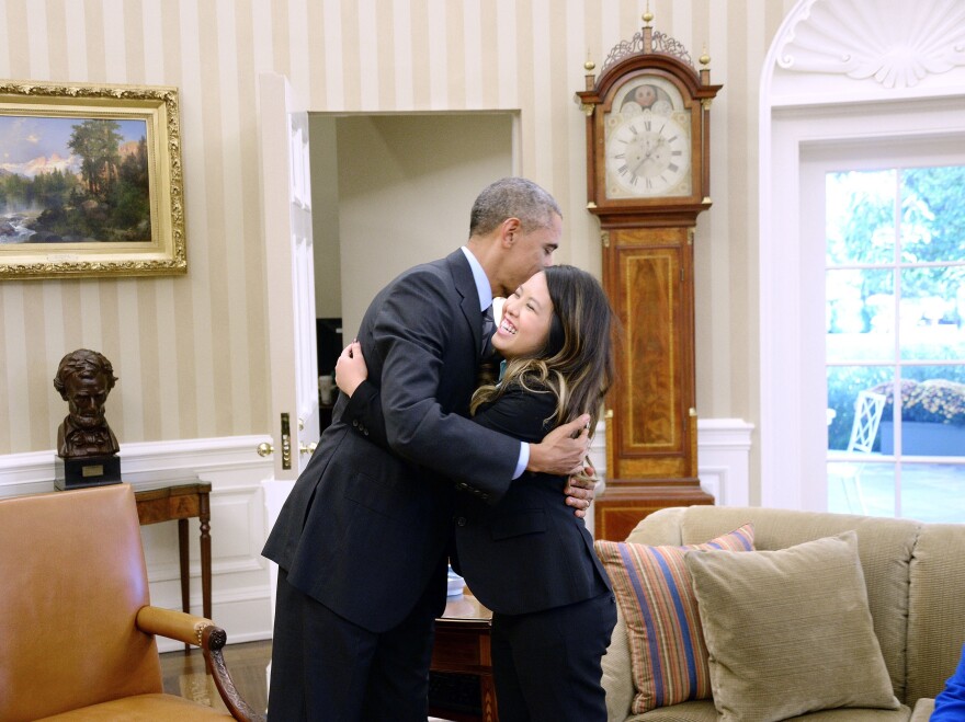 President Obama and Dallas nurse Nina Pham embrace in the Oval Office on Friday.
