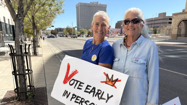 Michelle Schofield (L) and Rosa Weiss (R) holding signs on Lomas Wednesday October 7, 2026 on the first day of early voting for the general election on November 3, 2026.