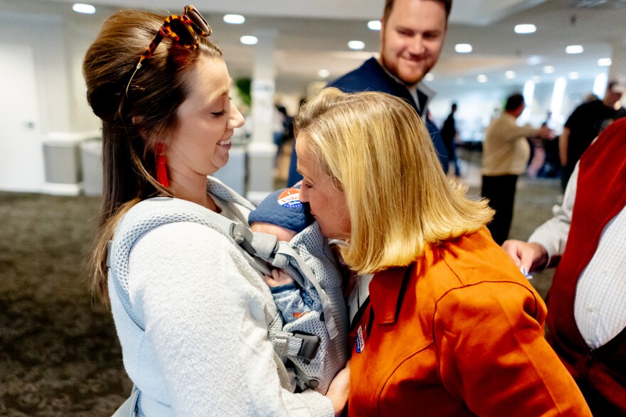 Republican U.S. Rep. Ann Wagner (MO-02) kisses her 8-week-old grandson Luke as he’s held by daughter Julia Wagner, 33, on Tuesday, Nov. 8, 2022, at the Ballwin Golf Course and Events Center in Ballwin. Wagner cast her ballot on Tuesday morning at the event center.
