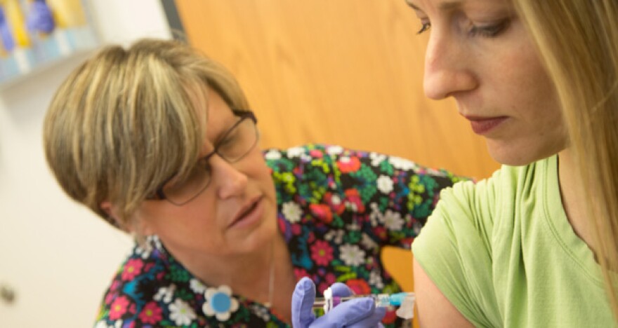 Lacey McKay receives a flu shot at the Oklahoma City-County Health Department in Oklahoma City on Thursday, Jan. 12, 2017.