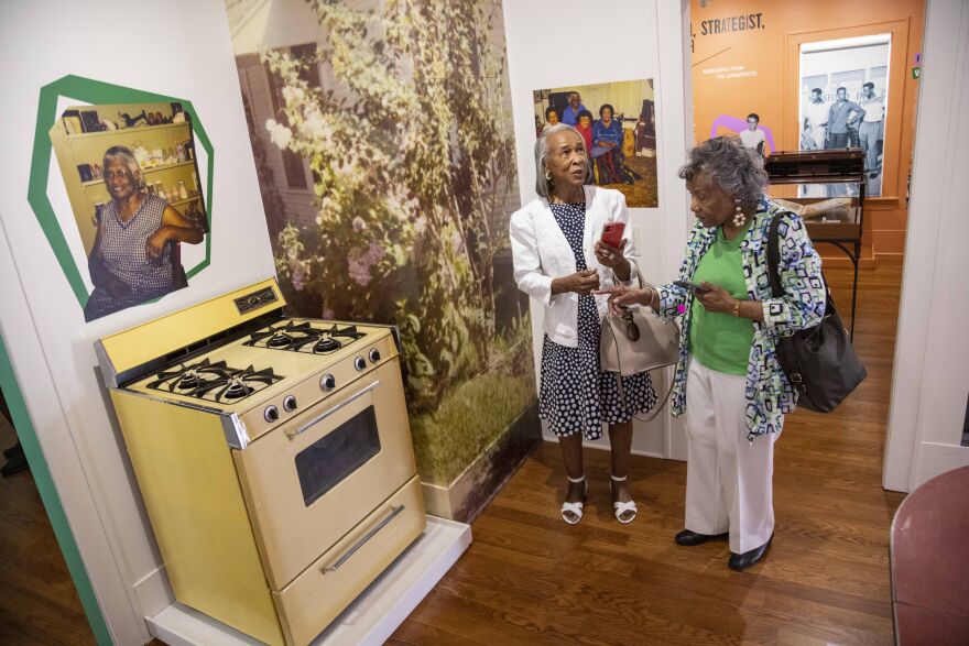 Mildred Honore and Roberta Hill look around the “At the Kitchen Table” section of the Juanita Craft Civil Rights House and Museum which displays pieces from Juanita Craft’s kitchen in Dallas on Saturday, May 20, 2023.