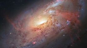 The inner structure of galaxy M106 (23.5 million light-years away) as seen by combining Hubble data with images taken by photographers.