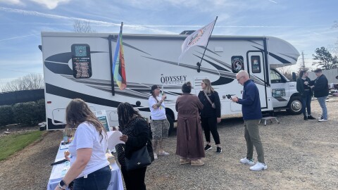 About a dozen people waited today to enter a 32-foot RV parked in Charlotte that aims to help LGBTQ+ and other underserved community members affirm their identities through official documentation.