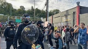 About 200 people showed up to protest outside the Immigration and Customs Enforcement building in Portland on Sunday, Sept. 28.