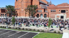 Thousands march down Central Parkway behind Music Hall on Sunday, May 31, in honor of George Floyd, the black Minneapolis man killed by a white police officer last week. 