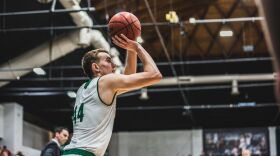 Action shot of Ryan Welty vs WU basketball