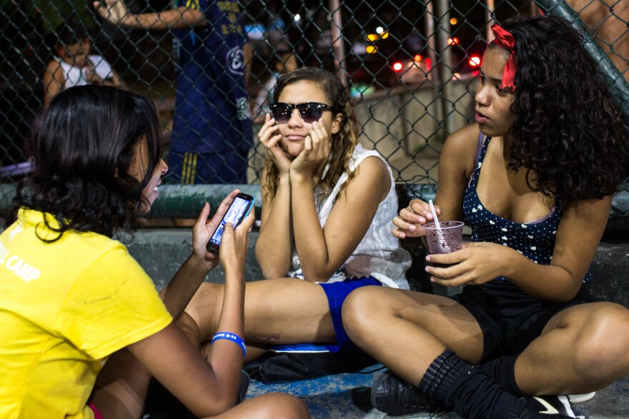 Lala (center) and Milena (left) would like to see more incentives for young Brazilian girls to take up soccer.