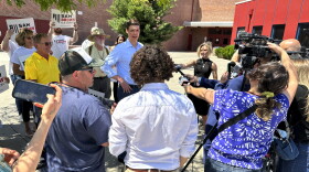 Nevada Senate hopeful Sam Brown speaks to reporters outside Reno High School after casting his primary ballot, Tuesday, June 11, 2024, in Reno, Nev.