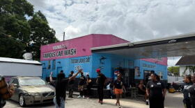Members of The Black Collective organization gather outside Famous Car Wash to support calls for accountability over a construction project. They are planning a rally and demonstration on Thursday, Oct. 22, 2026, to call attention to the heavy financial strain on local business caused by prolonged roadwork along Northwest 22nd Avenue in Miami.