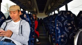 Two passengers on an otherwise empty shuttle bus in late March. The last day of the winter airport shuttle was April 6.