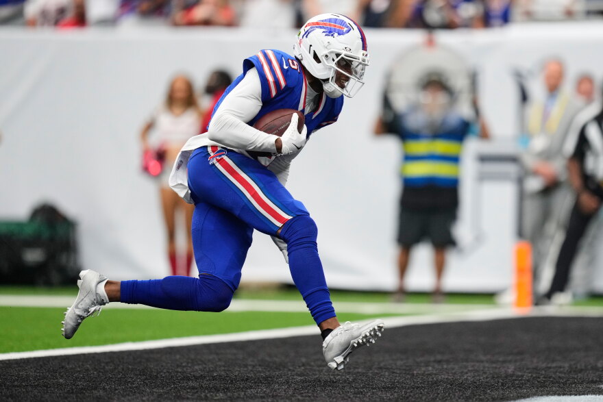 Buffalo Bills wide receiver Joshua Palmer runs the ball into the end zone for a touchdown during the second half of an NFL football game against the Houston Texans, Sunday, Sept. 13, 2026, in Houston.