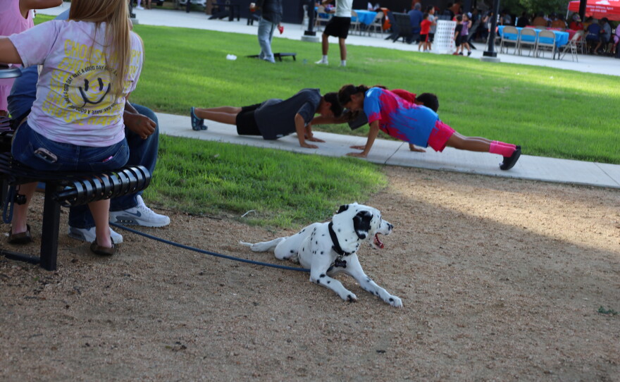 Children having a push-up contest at Riverside park during the 5th Annual Hispanic Heritage Celebration. Photo by Allison Diaz.