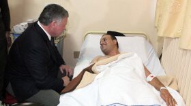 Jordan's King Abdullah II pays a hospital visit to people injured in Monday's shooting at a police training center.