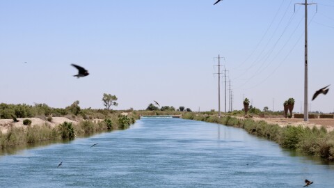 Water from the Colorado River flows through the East Highline Canal on its way to farms in the Imperial Valley on June 20, 2023. The Imperial Irrigation District recently agreed to conserve 100,000 acre-feet of water in 2023.