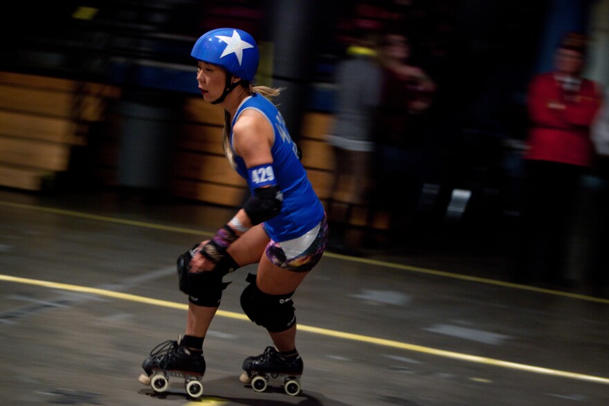 Jammer Elle L. Cool Jam skates around the rink. The jammer's job is to score points for her team.
