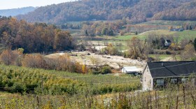 Jeff Nix's family farm, Flavor Full Farm, lost 10 acres of land because of Helene's powerful waters. The now cleared land used to look like the orchard on the left. Photo taken in Hendersonville, NC on October 29, 2024.