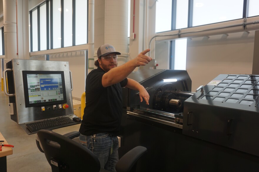 Heath Rhyneer of Solvus Global points to some of the equipment his company is using in the Missouri S&T Protoplex.