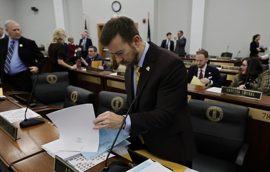 Rep. Adam Moore, D-Lexington, sorts through bills Tuesday during the opening session of the 2026 Kentucky General Assembly.