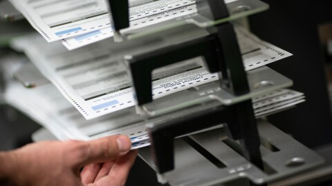 FILE - Poll workers sort ballots at the Kenosha Municipal Building on Election Day, Nov. 3, 2020, in Kenosha, Wis. (AP Photo/Wong Maye-E, File)