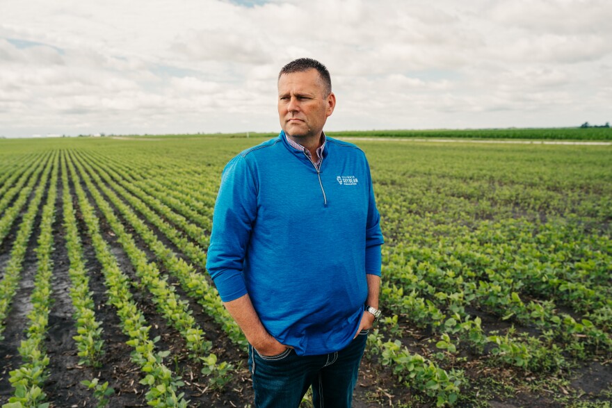 Kevin Johnson, the director of governmental affairs at the Illinois Soybean Association, stands among soybeans at his family farm on Thursday, June 18, 2026, in Rankin, Illinois.