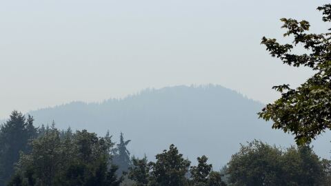 The view of Spencer's Butte in Eugene usually reveals rows of hills in the background. But on Aug. 5, 2026, the butte itself is barely visible through