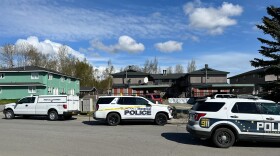 Anchorage police vehicles outside a Bearfoot Drive apartment complex where officers fatally shot an armed man on Monday, May 13, 2024. (Chris Klint/Alaska Public Media)