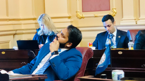 Northern Virginia Senator Saddam Salim peers at the vote board during a Senate floor session.