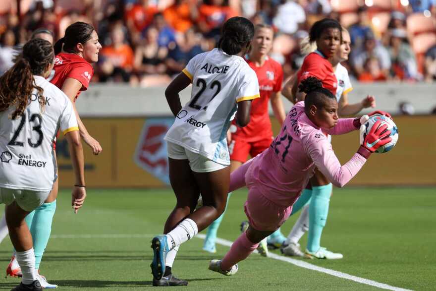 AD Franch, in pink, makes a save for the Kansas City Current during the 2022 season. She helped lead the team to the NWSL championship game, and has been called up to the women's national team twice since.