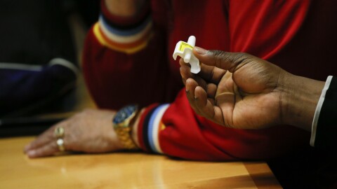 A man holds a sample of the opioid antidote Narcan during a training session at a New York City Department of Health and Mental Hygiene office in March.