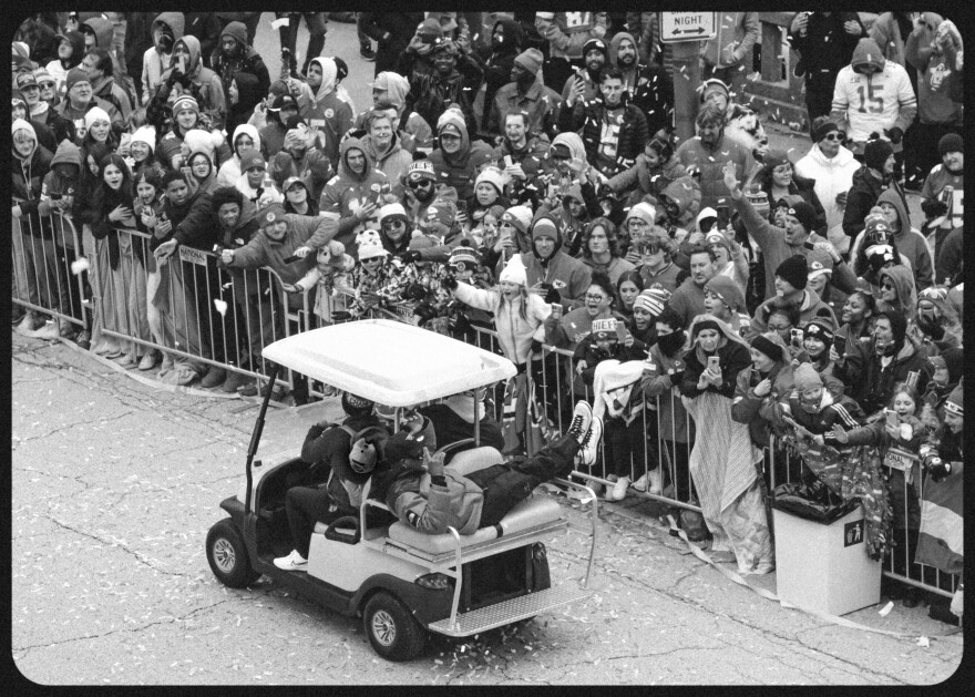  A golf cart drives by screaming Chiefs fans during the Super Bowl parade on Feb. 15, 2023.