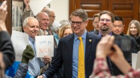 Alaska Congressman Nick Begich shakes hands with a support