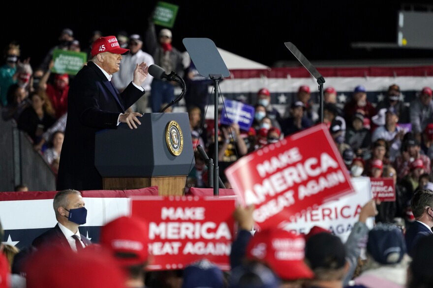 President Donald Trump speaks at a campaign rally at Des Moines International Airport, Wednesday, Oct. 14, 2020, in Des Moines, Iowa.