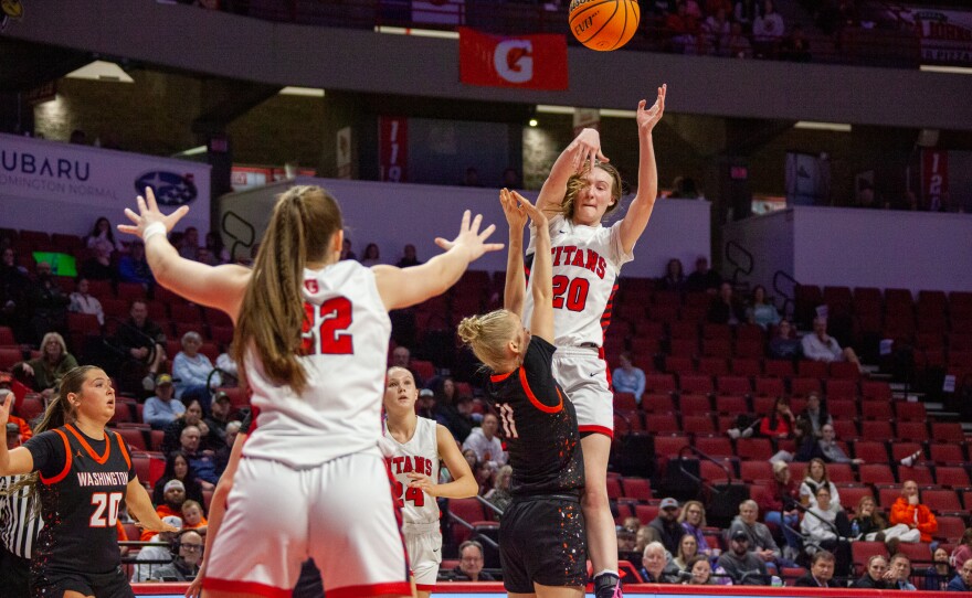 Girls high school basketball players inside an arena