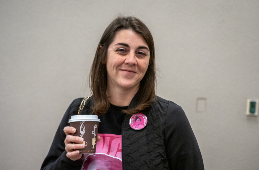 Melissa Moore poses with a coffee cup at a rally for Jacksonville Democratic state Rep. Angie Nixon at the Osceola Heritage Park events center in Kissimmee on Tuesday, Oct. 27. Moore has been volunteering with Nixon’s campaign this year. She thinks Nixon’s focus on younger voters is paying off.
