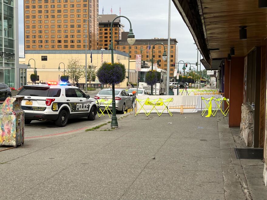 Police barricades and evidence markers outside The Gaslight Lounge following a fatal shooting on Sunday, July 20, 2025.
