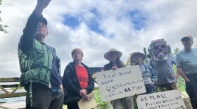 Denny Alsop, Clare Lahey, Gail Ceresia, Caroline Young, Marc Maloni, wearing a mask, and Tim Grey at a protest in Lee, Massachusetts against the EPA's cleanup plan of the Housatonic River. (from l to r)