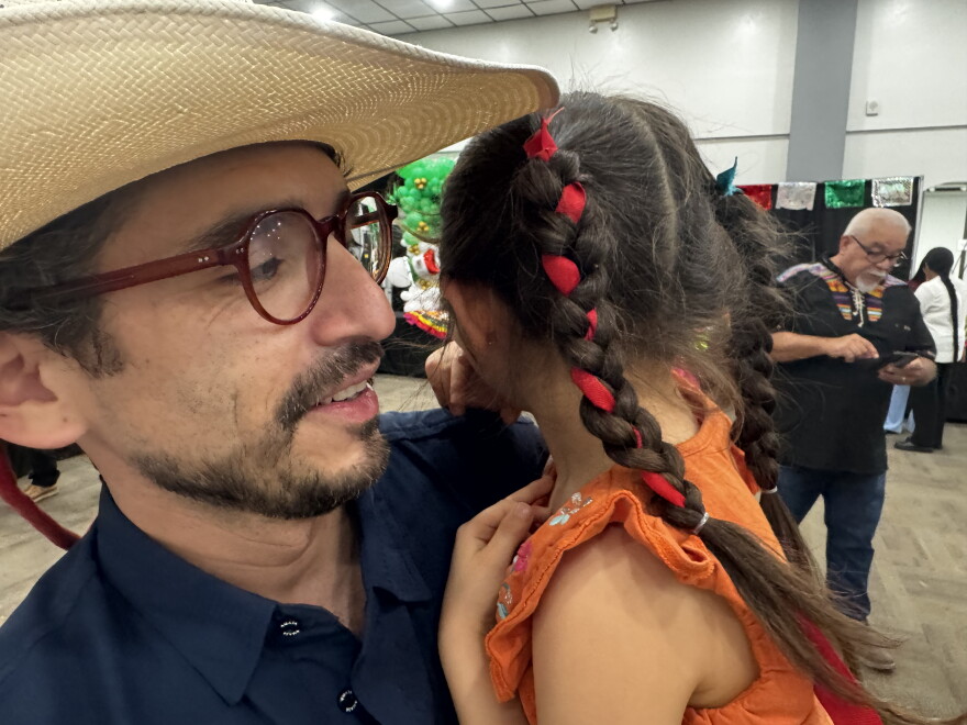 4 year old, Ivanna Marquez, wore a traditional outfit, pink mexican boots and trenzas.