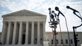 A set of microphones stand outside of the U.S. Supreme Court in Washington, DC. 