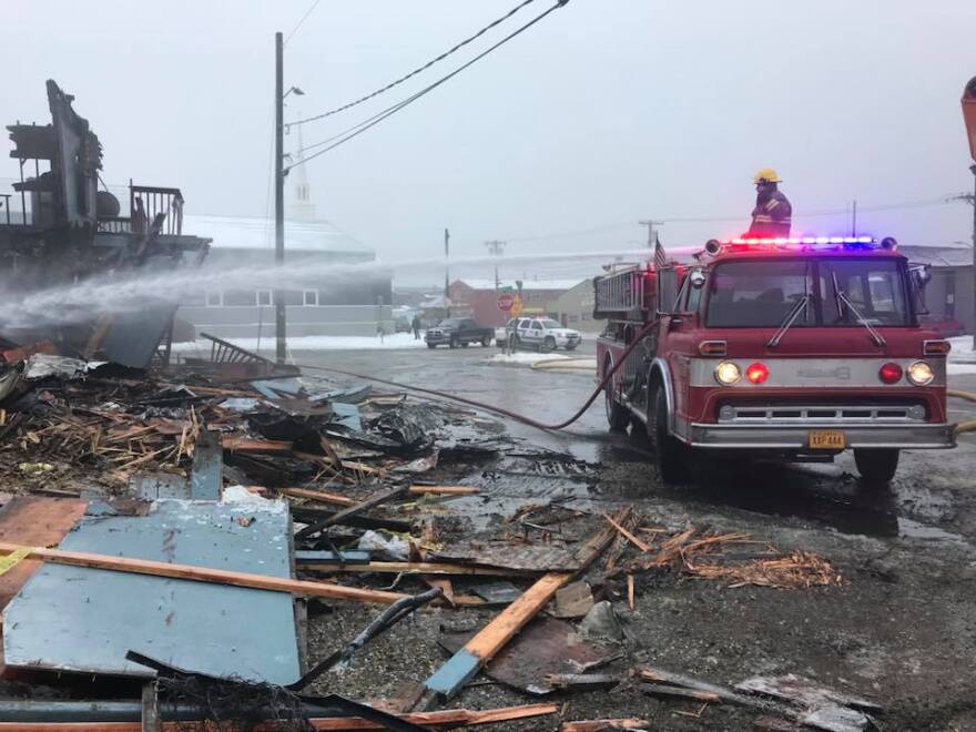 Nome’s volunteer firefighters spray what remains of the Polaris Hotel earlier today to cool off the site before investigators with the State Fire Marshal’s Office arrive. Images below: scenes from the Polaris Hotel fire site on Wednesday. (Image courtesy of John Handeland.)