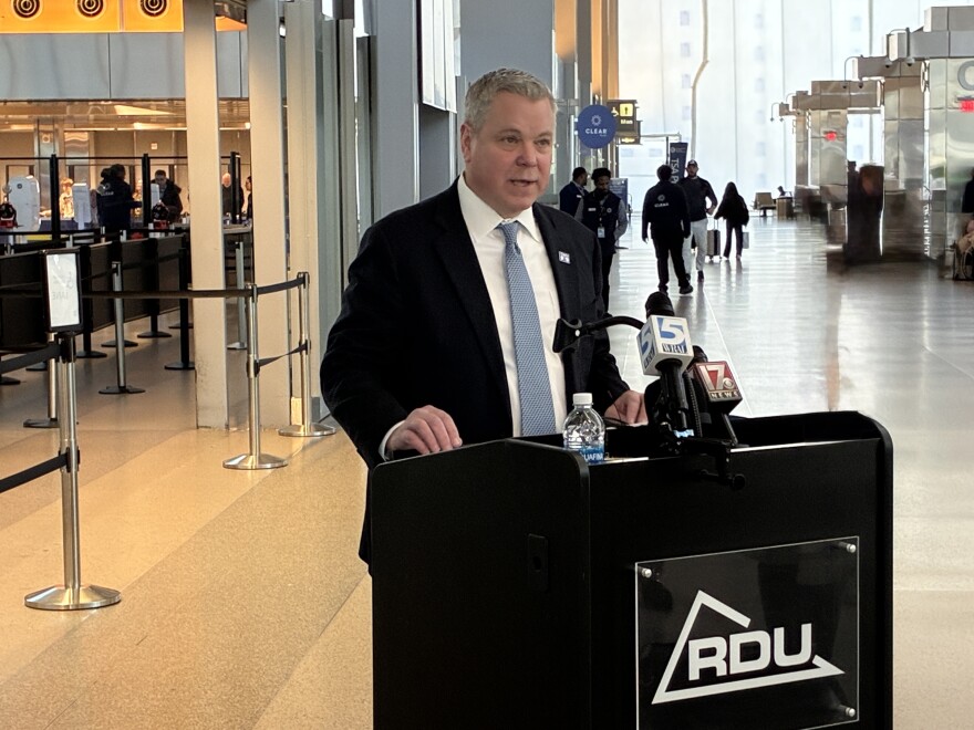 North Carolina DMV commissioner Paul Tine speaks to the media at Raleigh-Durham International Airport on January 12, 2026.