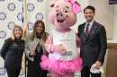 From left: Pig Works CEO Iris Simpson Bush, Hamilton County Commission President Alicia Reece, Miss Piggy, and Cincinnati Mayor Aftab Pureval.